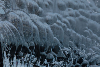 Full frame shot of icicles on land