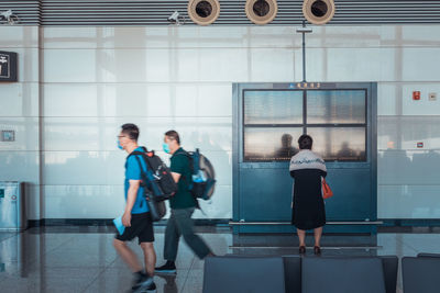 People walking in modern office building