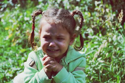 Cute girl crying at park