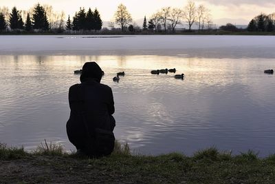 Reflection of man in a lake