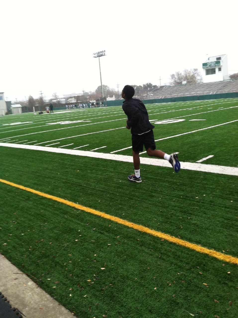 full length, grass, lifestyles, childhood, leisure activity, casual clothing, walking, rear view, sport, field, road, street, boys, playing, park - man made space, day, grassy, elementary age