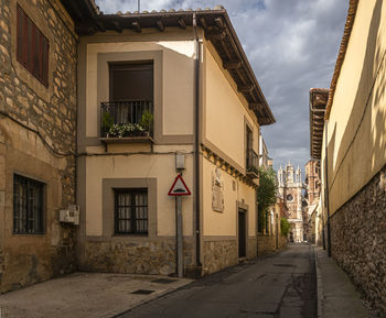Street amidst buildings in city against sky
