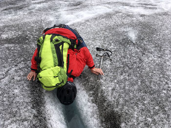 High angle view of child in snow