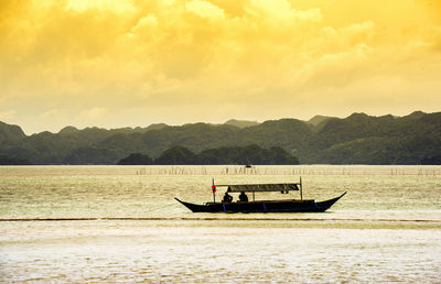 Boat in sea against sky