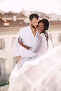 Young couple standing outdoors