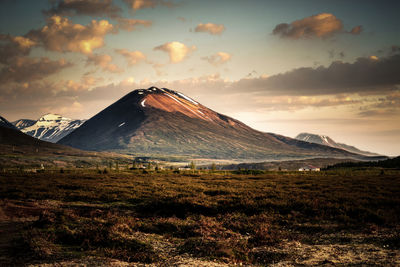 Scenic view of mountains against sky during sunset