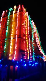 Low angle view of illuminated lights at night