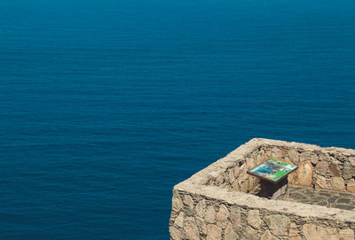 High angle view of sea against blue sky