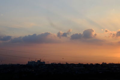 Silhouette trees against sky during sunset