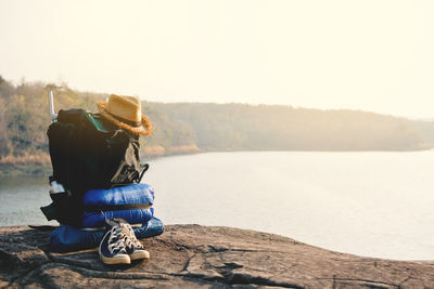 Rear view of backpack by the lake