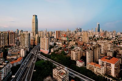 High angle view of buildings in city against sky