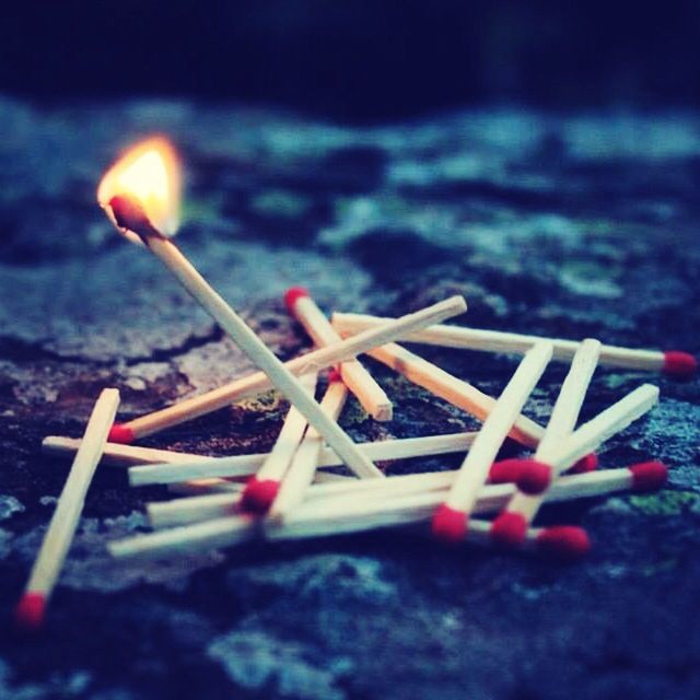 burning, flame, focus on foreground, selective focus, close-up, illuminated, fire - natural phenomenon, night, heat - temperature, candle, glowing, no people, large group of objects, wood - material, lit, outdoors, in a row, still life, religion, tradition