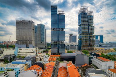 Modern buildings in city against sky