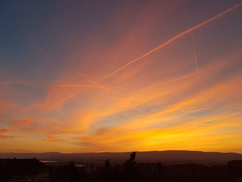 Scenic view of silhouette landscape against romantic sky at sunset