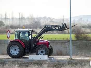 Tractor on field against sky