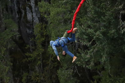 Low angle view of man climbing on mountain