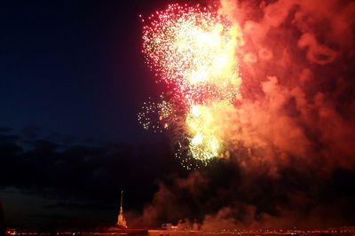 Low angle view of firework display at night