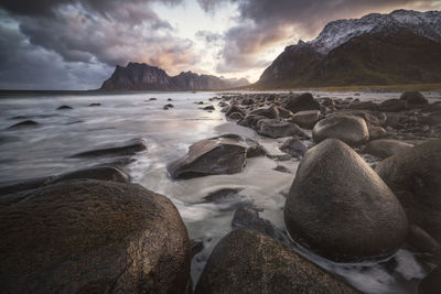 Rocks and water in vareid beach in lofoten