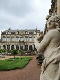 Statue of historic building against sky