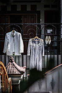 Clothes hanging on window of building at store