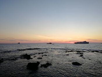 Scenic view of sea against sky during sunset