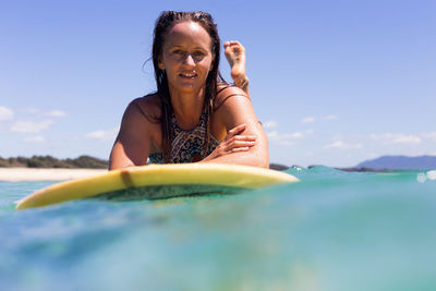 Portrait of a smiling young woman in sea