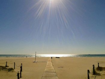 Scenic view of beach against clear sky