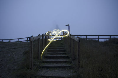 Staircase on road against sky