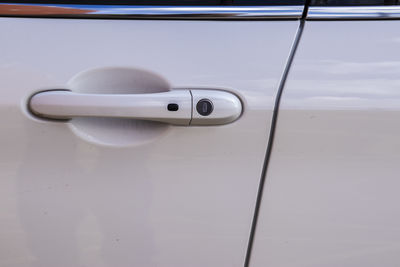 Detail of a car door handle. focuses on the design and usability elements of modern vehicles. 
