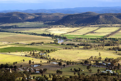 High angle view of agricultural field against buildings