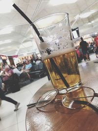 Close-up of beer glass on table