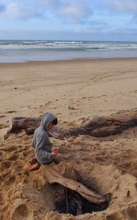 Man on beach against sky
