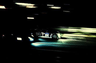 Blurred motion of car in illuminated tunnel