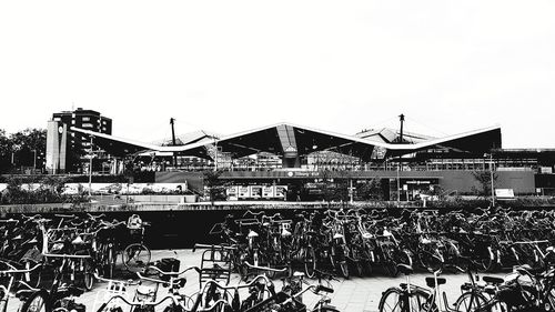Group of people on building against clear sky