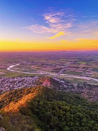 Aerial view of cityscape against sky during sunset