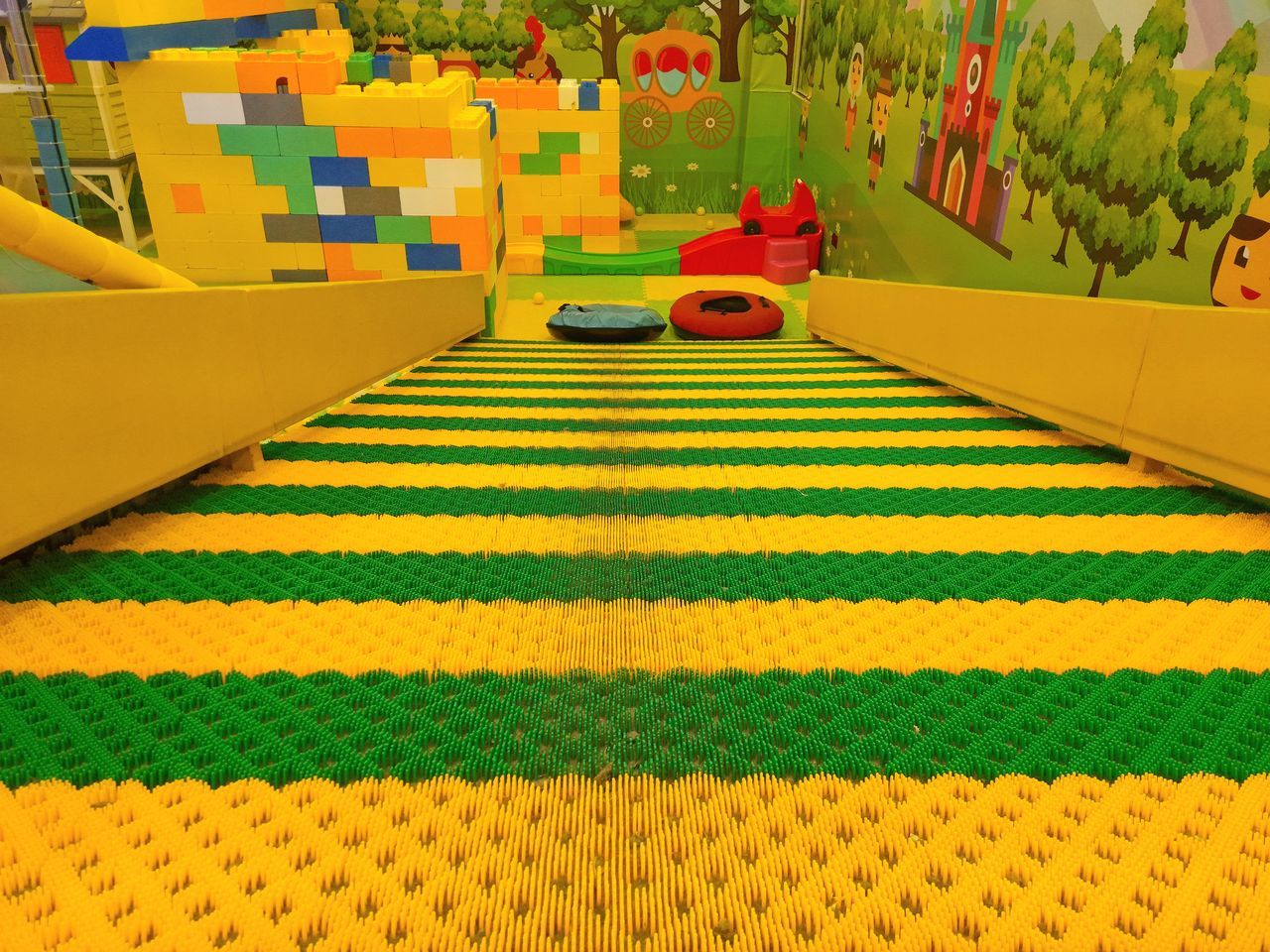 yellow, multi colored, playground, green, screenshot, no people, pattern, plant, architecture, day, outdoors, transportation, nature, built structure, lawn