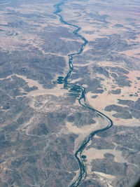 The oranje river meanders along the border of namibia and south africa, next to village haklesdoorn.