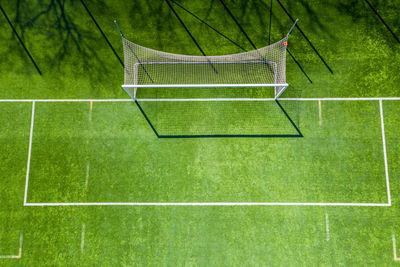 Aerial view of a smal sports soccer football field. gate from above