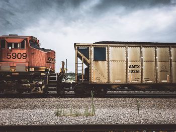 Train on railroad track against sky