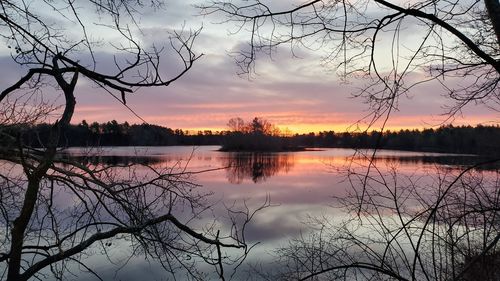 Scenic view of lake against orange sky