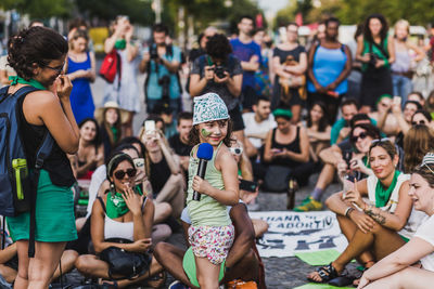 Group of people sitting outdoors