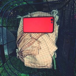 High angle view of red arrow symbol on table