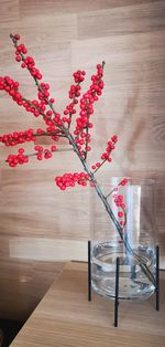 Close-up of red berries on table at home
