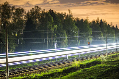 High angle view of light trails on road against sky