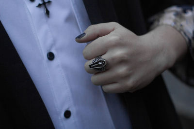 Close-up of man hand on wall