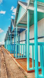 Colourful huts along a beach 