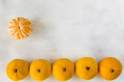 Directly above shot of orange fruits on table