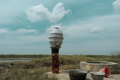 View of the well and the watercourse against the sky