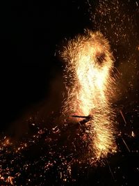 Close-up of firework display at night