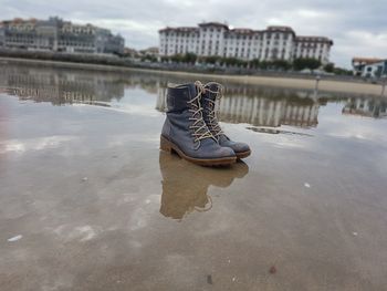 High angle view of shoes in water against sky
